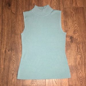 Turquoise turtle neck shirt.